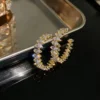 Boucles d'oreilles coréennes en forme de C en argent.