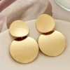 1 paire de boucles d'oreilles pendantes circulaires en mosaïque géométrique simple pour femmes.