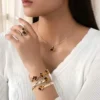 Ensemble de 5 colliers, boucles d'oreilles et bracelets en cuivre à cinq pétales minimalistes.